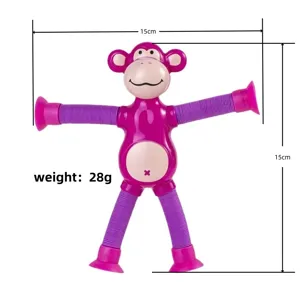 Front view showing dimensions of the pink monkey suction cup stretch tube decompression toy