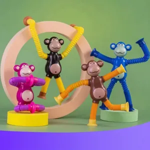 Set of four colorful stretch tube monkey toys with suction cups for sensory stress relief