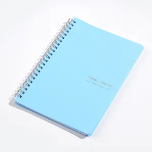 Detail view of a light blue 52-week non-dated spiral weekly planner notebook