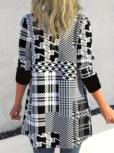 Back view of women's loose long-sleeve cardigan with black and white houndstooth plaid pattern