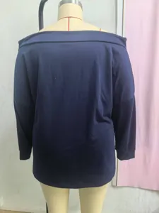 Detailed back view of a loose navy blue off-the-shoulder long sleeve sweatshirt on mannequin