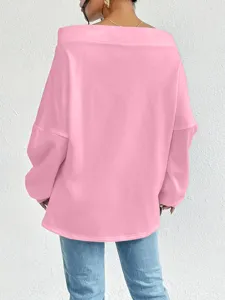 Back view of a stylish pink off-shoulder sweatshirt with a loose fit and casual design