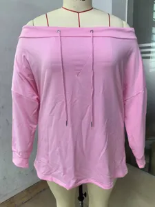 Detailed view of pink off-the-shoulder sweatshirt with drawstrings and loose fit
