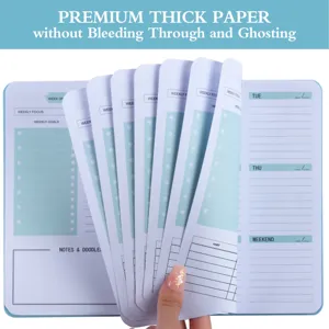Detailed view of premium thick paper in a 52-week English planner weekly notebook.