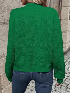 Back view of a green textured long-sleeve casual jacket for women outdoors