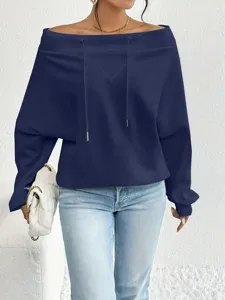 Detail of navy blue off-the-shoulder sweatshirt with drawstring and relaxed fit.