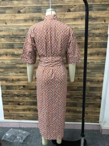Back view of a geometric print shirt dress with half sleeves shown on mannequin