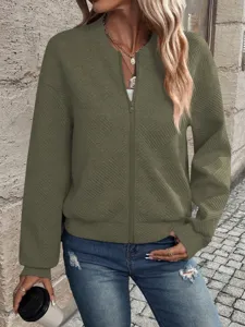 Detailed view of the diamond texture on a women's olive green zip-up bomber jacket