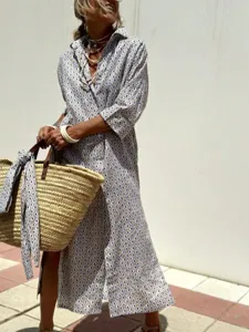 Bohemian geometric print maxi shirt dress with turn-down collar and button-down front.