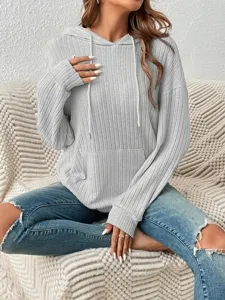 Detail view of casual gray ribbed knitted hoodie featuring kangaroo pocket and drawstring