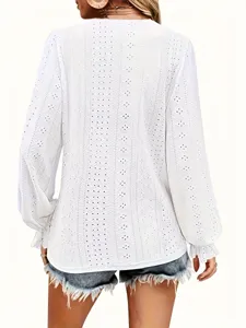 Detailed back view of white eyelet hollow lace blouse featuring elegant ruffled cuffs