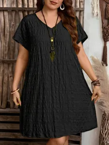 Close-up showing the unique pleated texture and V-neck design of this black summer dress