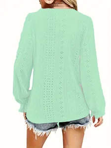 Back view of mint green long sleeve eyelet top featuring ruffle sleeve detail textures