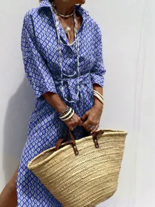 Elegant blue and white ikat print shirt dress with lapel collar and stylish waist tie belt