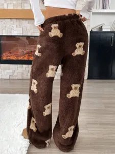 Back view of brown fuzzy sherpa pants featuring a cute teddy bear pattern for women.