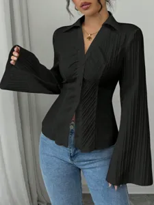 Elegant black V-neck button-up blouse with dramatic flared sleeves and pleated texture