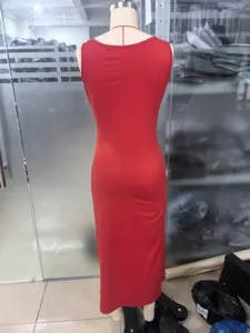 Rear view of a slim-fit red sleeveless maxi dress displayed on a mannequin in a studio setting.
