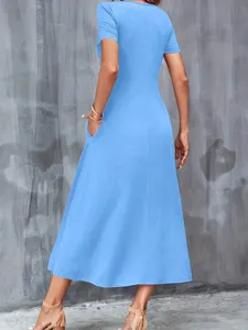 Back view of a light blue casual short sleeve dress with side pockets for women.