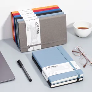 Premium A5 dotted bullet journal notebook with fabric cover and elastic strap closure