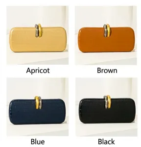 Elegantes bolsos de fiesta con grabado de cocodrilo en albaricoque, marrón, azul y negro.