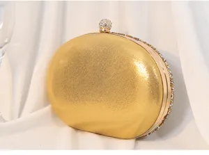 Elegante goldene ovale Clutch mit Strassbesatz und funkelndem Kugelverschluss-Detail