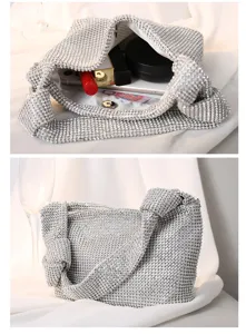 Detailed view of silver full rhinestone evening bag showing interior capacity and handle
