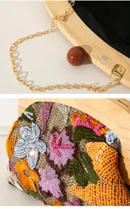 Close-up of handmade floral sequin embroidery and solid wood handle detail on banquet bag