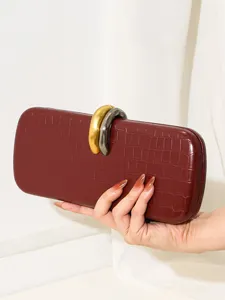 Elegante bolso de noche burdeos con patrón de cocodrilo y exclusivo cierre de metal bicolor