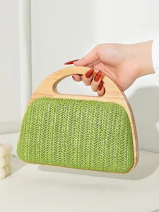 Elegante grüne strohgewebte Abendhandtasche mit einem handgefertigten Echtholzgriff