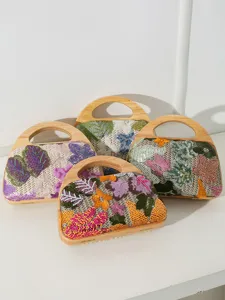 Handmade floral embroidered evening bags with solid wood handles in four colors.