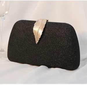 Elegant black glitter evening clutch bag with decorative gold leaf metal clasp detail