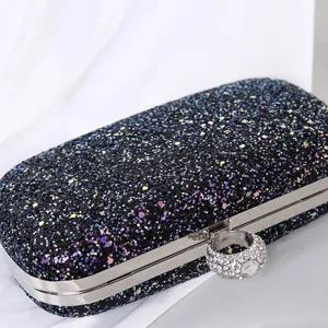 Elegante schwarze Glitzer-Abendtasche mit Strass-Ringverschluss für Partys und Galas.