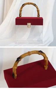 Detailansicht der transparenten Acryl-Geschenkbox mit samtigem Deckel und Bambusgriff.