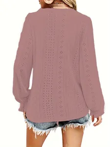 Detailed back view of a dusty pink hollow-out lace top featuring ruffled long sleeves