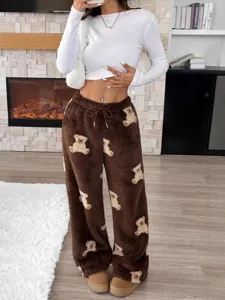 Warm brown fleece trousers with adorable teddy bear pattern and adjustable drawstring waist