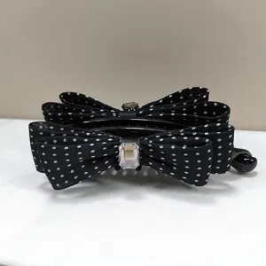 Elegant black polka dot bow hair banana clip with a sparkling clear crystal center