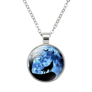 Detailed view of wolf howling at blue moon pendant with silver link chain