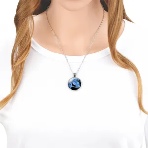 Close-up detail of a howling wolf pendant necklace worn on a stainless steel chain