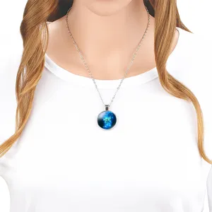 Close-up of a 25mm blue butterfly glass pendant necklace worn on a white t-shirt.