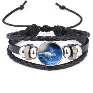 Detailed view of multi-layer leather bracelet featuring a white wolf graphic dome