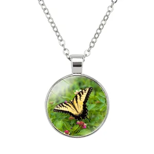 Macro detail of a 25mm yellow butterfly pendant necklace with a stainless steel chain
