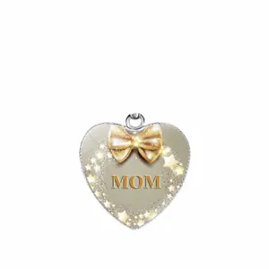 Elegant heart shaped MOM pendant featuring a golden bow and stars for Mother's Day