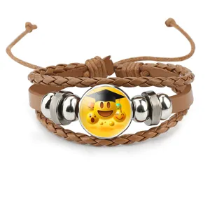 Detailed view of Emoji graduation theme leather bracelet with metal beads