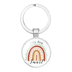 Round silver metal keychain featuring a boho rainbow design and 'You Are Smart' message