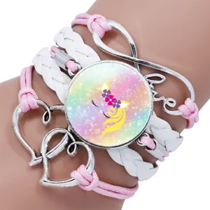 Close-up of pink multi-layer unicorn bracelet with rainbow time gem and love heart charms