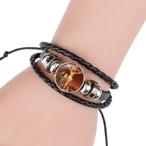 Braided black leather bracelet with Jesus crucifixion religious charm detail