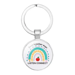Detail view of silver teacher keychain featuring rainbow and Best Teacher Ever print design