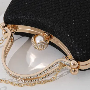 Luxuriöse schwarze Gitter-Abendtasche mit Perlenverschluss und Strassgriffen