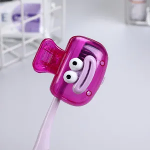 Close-up of portable cartoon toothbrush clip cover in transparent purple color.