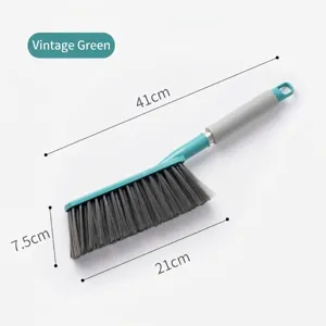 Detail view of vintage green long handle bed cleaning brush showing 41cm overall length